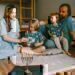 A family seated on the floor, celebrating hanukkah together.