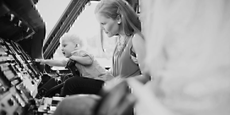 A mother with her child looking through some merchandise.