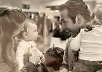 A father comes home to children and gives them a warm welcome.