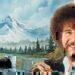 Bob Ross working on one of his famous paintings.