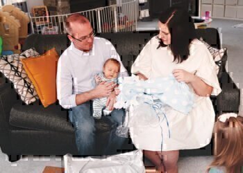 Hannah Kimmick and her family hold their newest member.