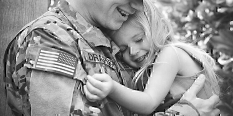 A father holding his daughter after a reunion.