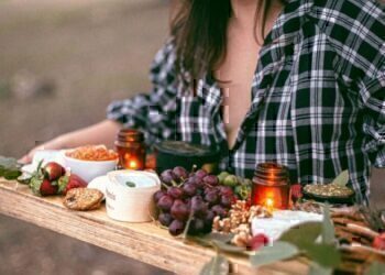 A young women carrying her homemade Thankgiving Day appetizer platter.