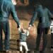 A family walking down a dirt path together.