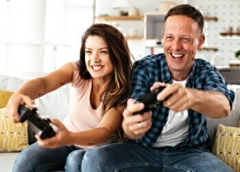 A couple playing competitive video game together.