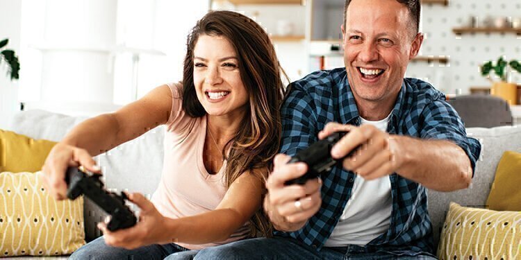 A couple playing competitive video game together.